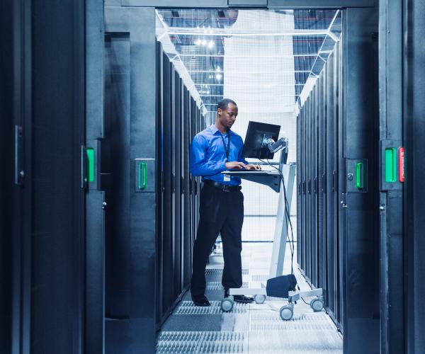 A man standing in a server room